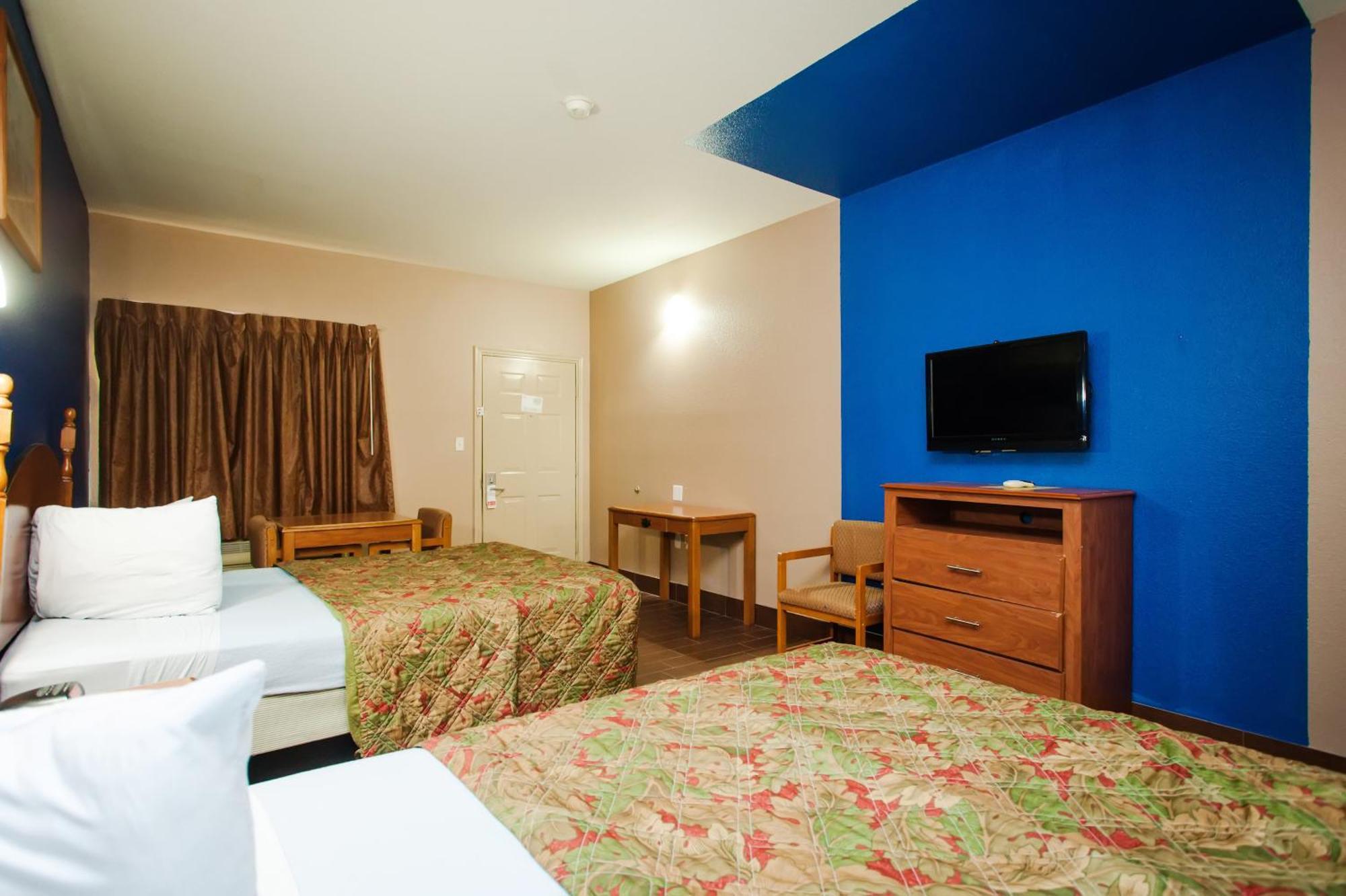 Scottish Inn & Suites Hankamer Habitación foto